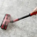 Cleaning a tiled floor with a steam mop