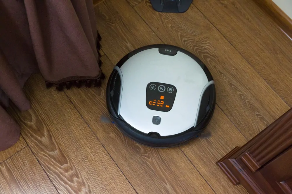 Robot vacuum on hardwood floor