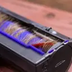 A vacuum brush full of hair