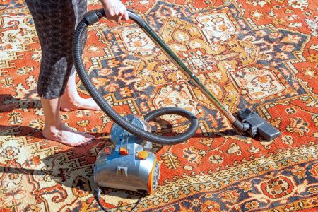 Cleaning a carpet with a bagged vacuum