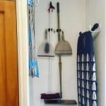 Keeping broom and mop on a wall hanger