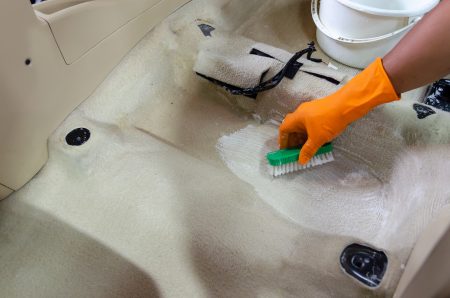 Cleaning a car carpet with the best car carpet cleaner solution