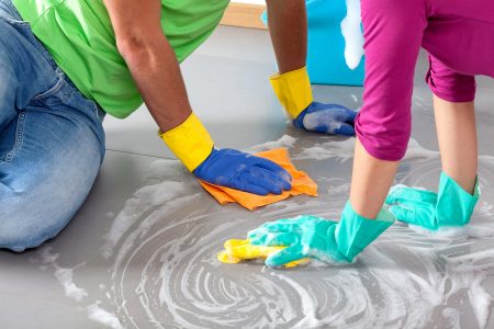 couple cleaning floor