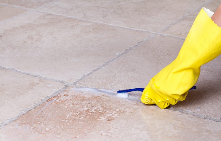 cleaning tile grout with toothbrush