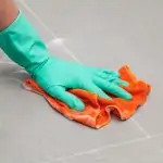 Man cleaning porcelain tile floors