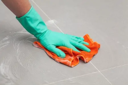 Man cleaning porcelain tile floors