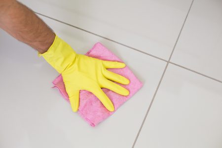 Woman cleaning tile floors