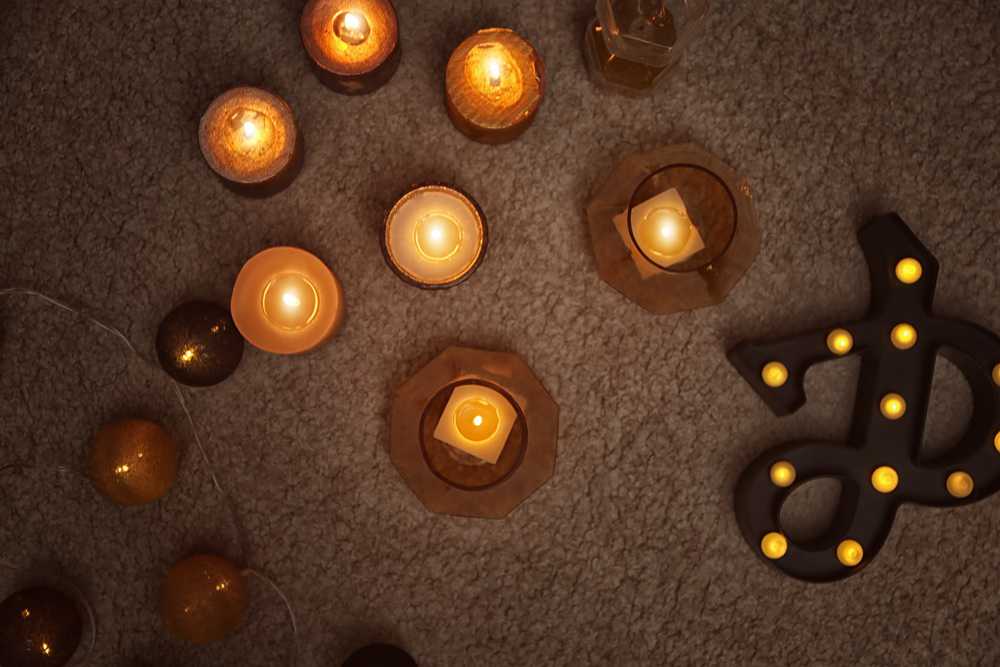 Burning candles on carpet