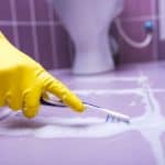 Cleaning tile grout using toothbrush