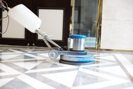 Cleaning a marble floor with polisher