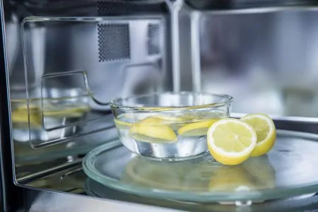 Cleaning a microwave with a lemon