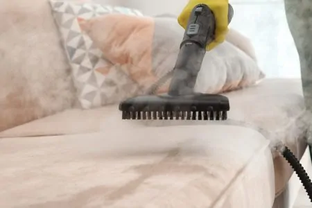 Steam cleaning a couch
