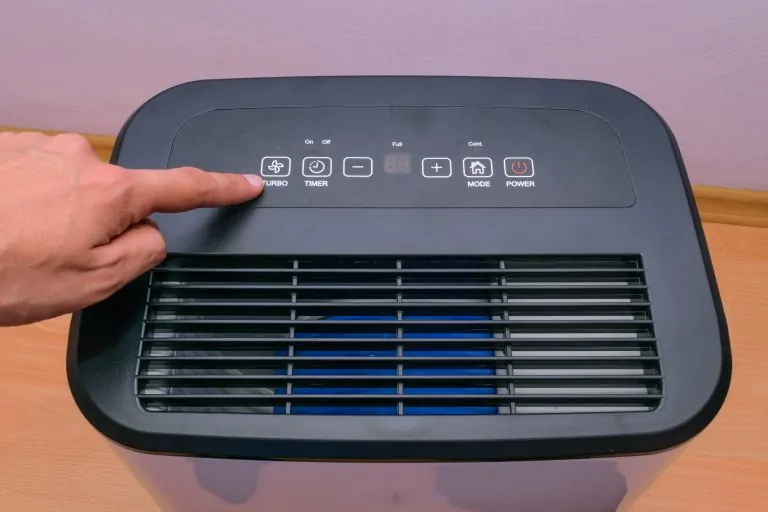 Man setting up house hold dehumidifier