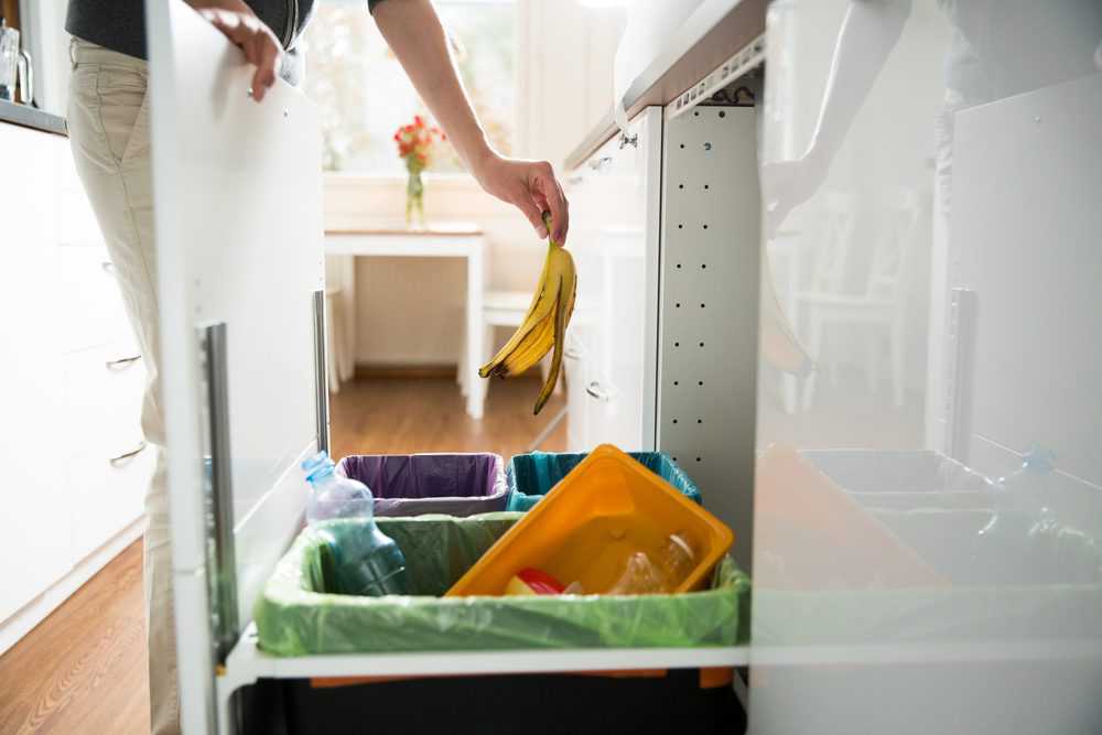 Woman throwing out garbage