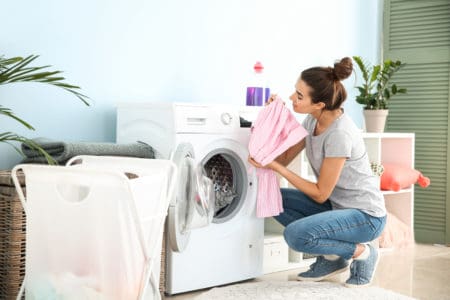 Woman taking out fresh smelling laundry