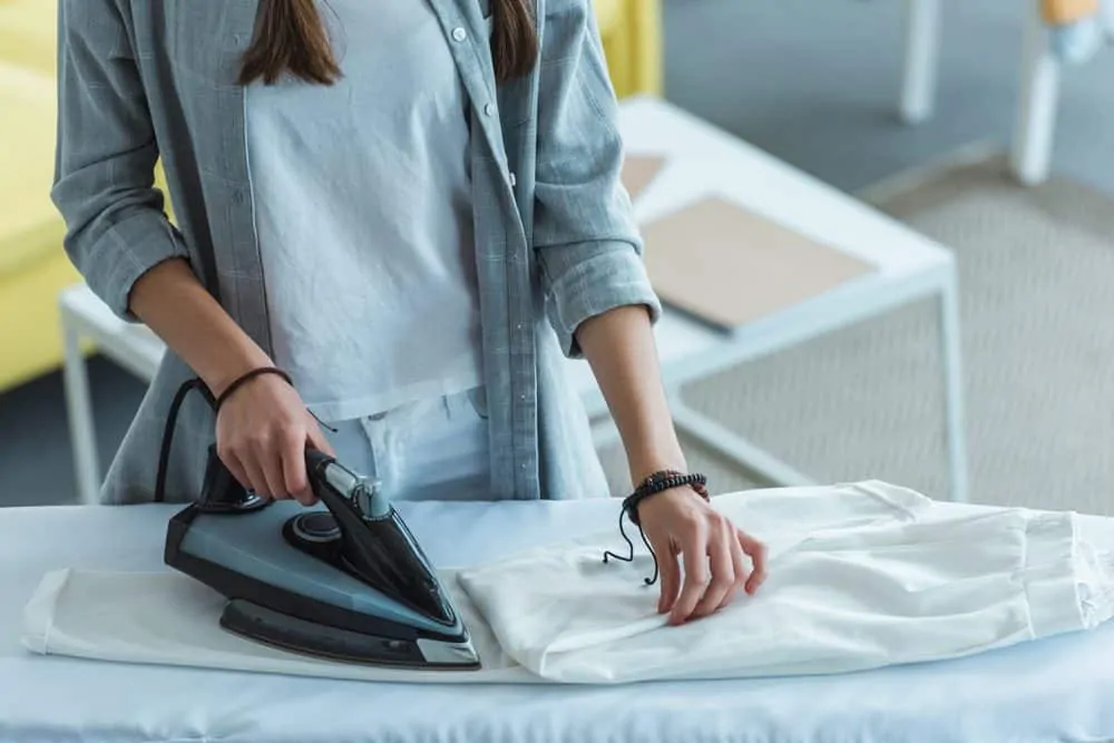 Woman ironing dress pants