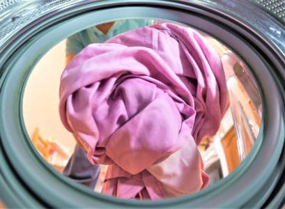 Man washing silk in washing machine