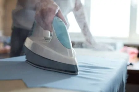 Ironing clothes with a steam iron