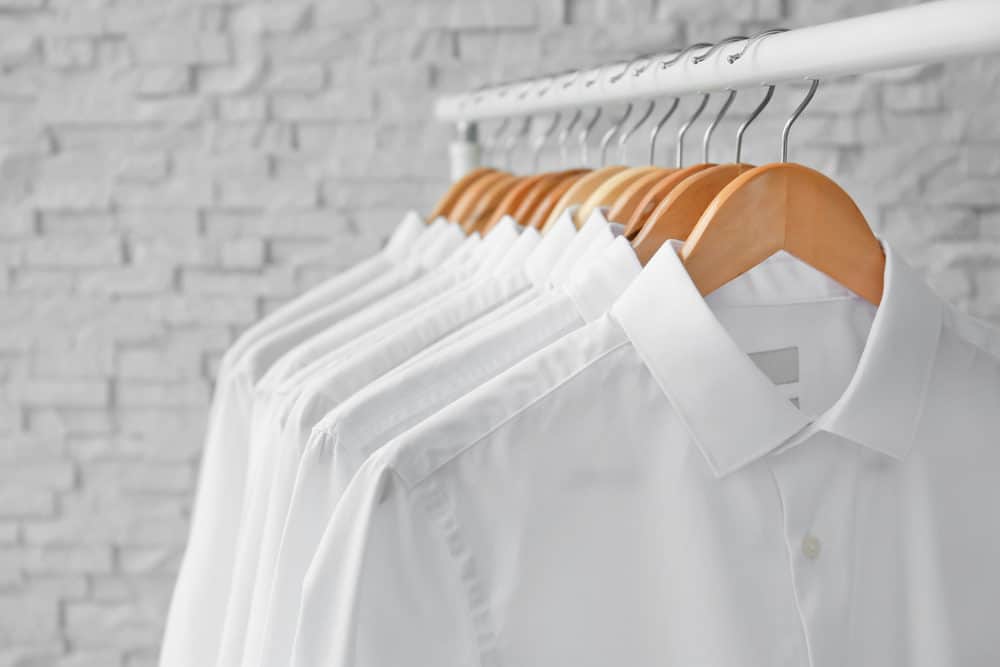 Starched white clothes on a rack