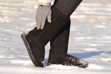 Woman wearing ugg boots in the snow