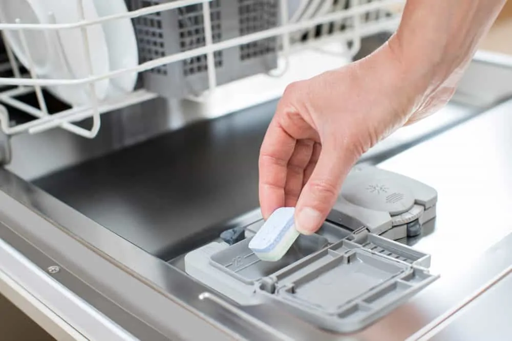 Filling dishwasher with dishwasher pod