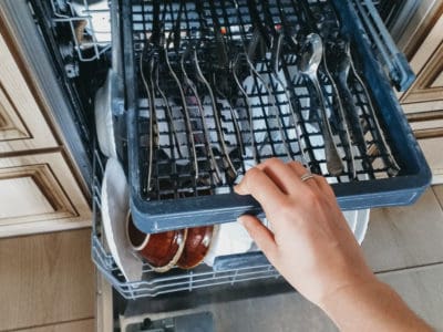 Open the dishwasher with clean dishes