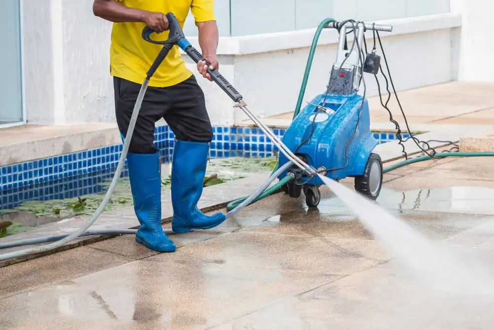 man preparing to winterize his pressure washer outdoor