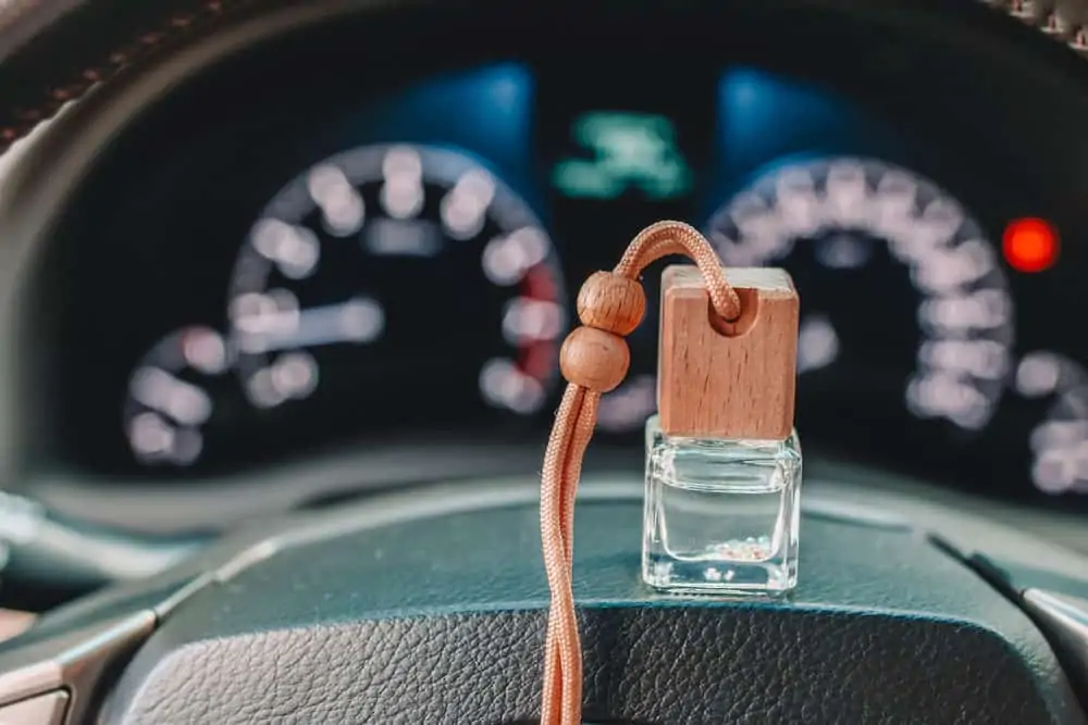 Car perfume or air freshener on the dashboard