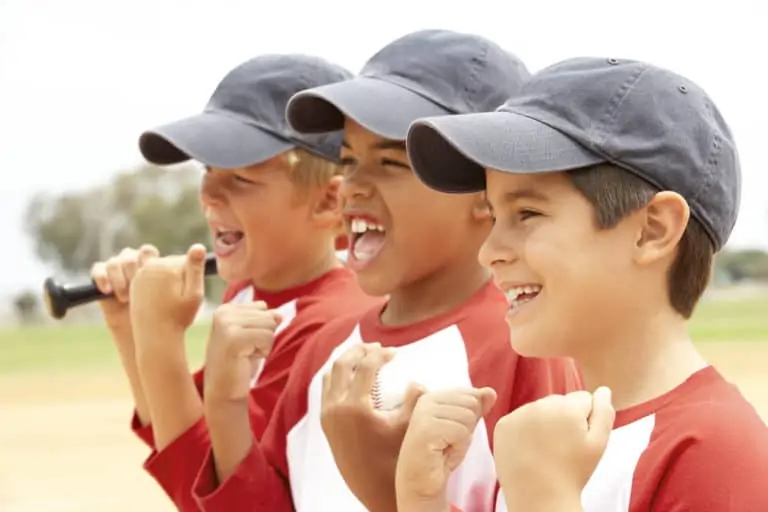 Young boys wearing baseball caps