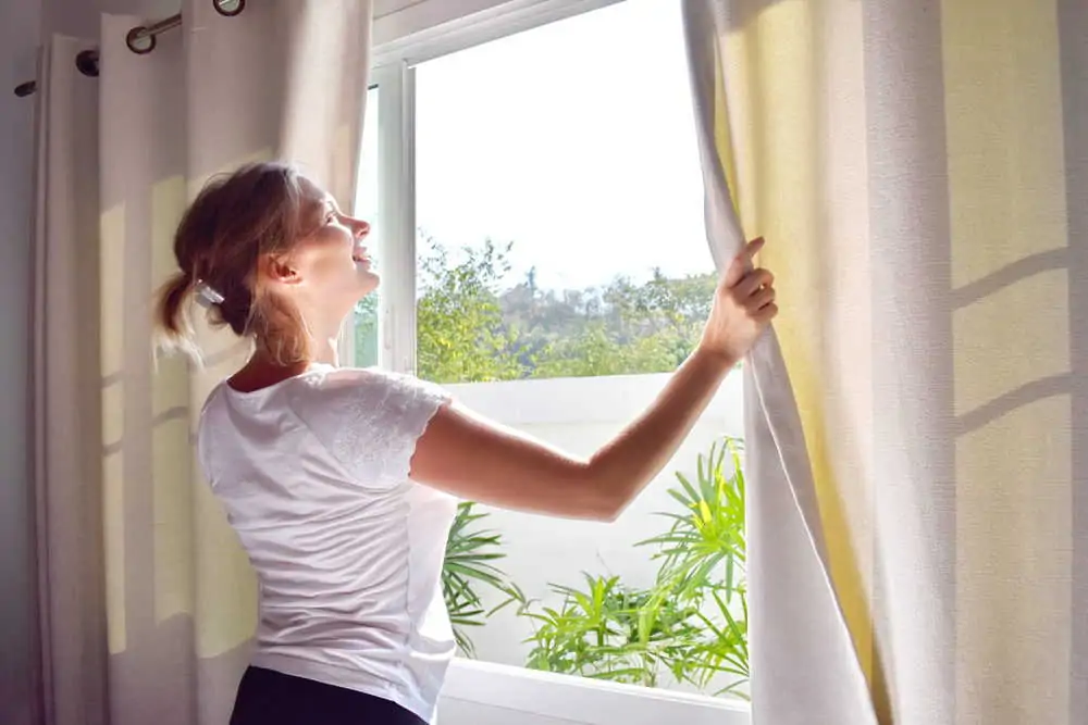 Woman opening the windows