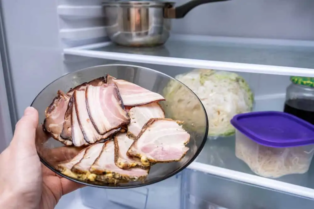 Clearing old food from fridge