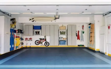 Clean garage with cabinets and minimal stuff