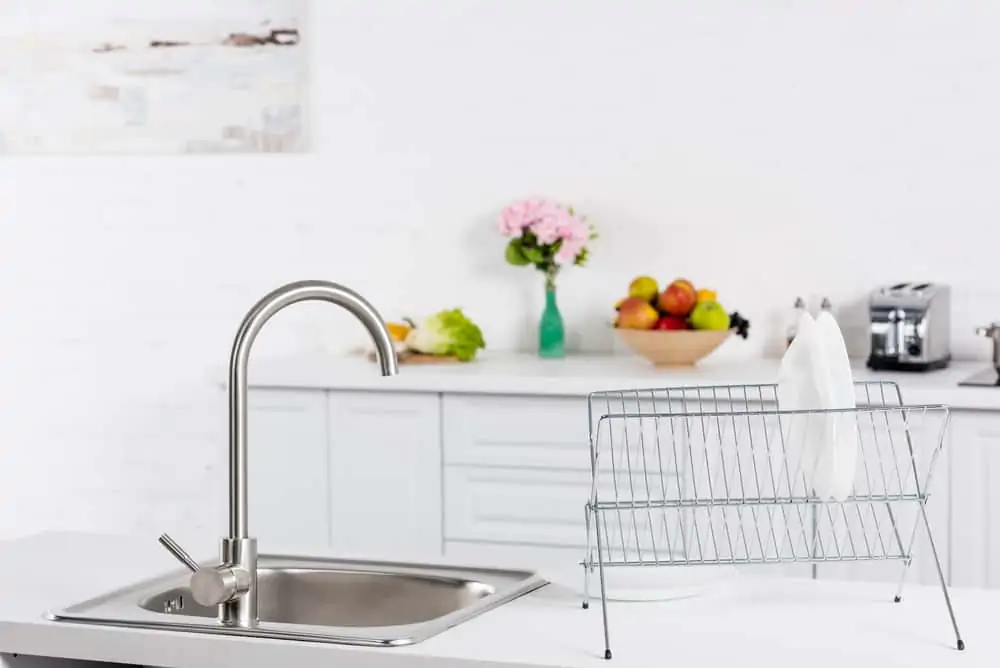 Kitchen sink and dish rack on countertop