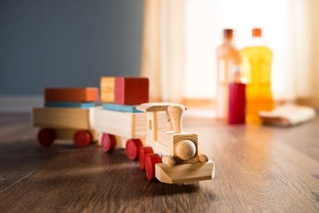 Wooden toy train with wood cleaning products