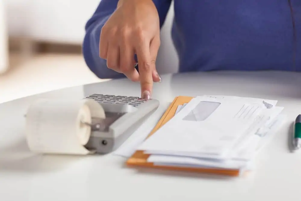 Woman computing household bills