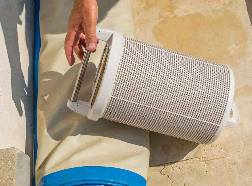 Man holding a pool filter