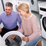 Mature couple choosing a washer
