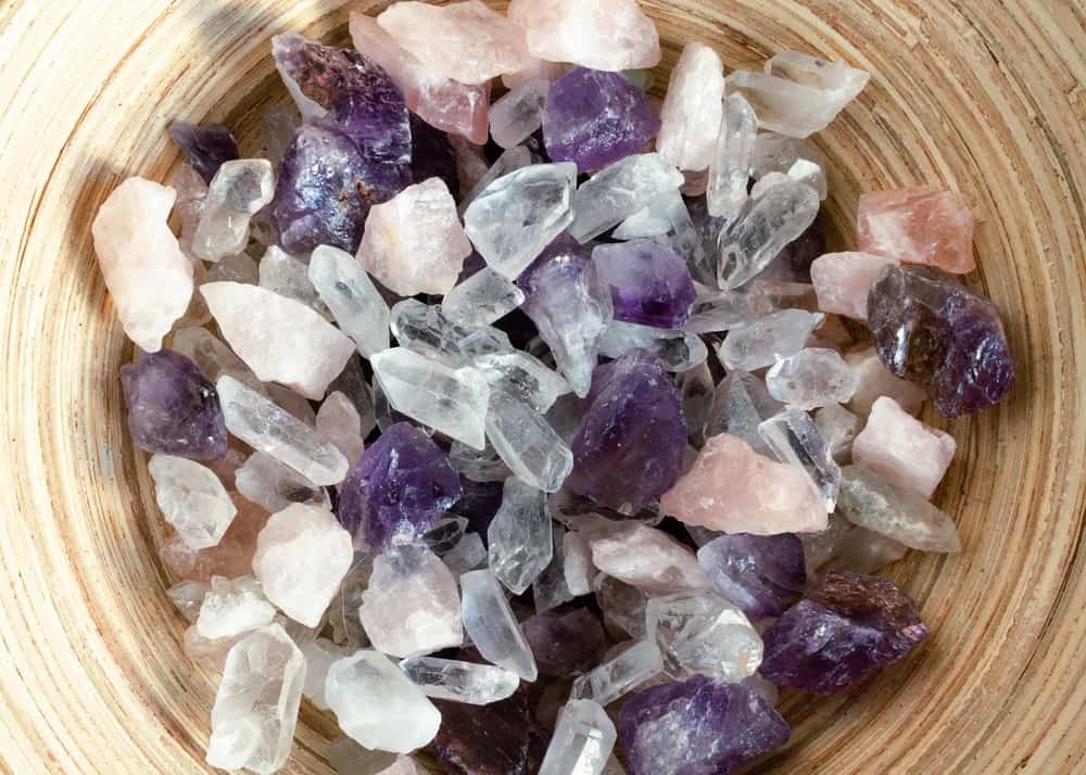 Rocks and crystals in a wooden bowl