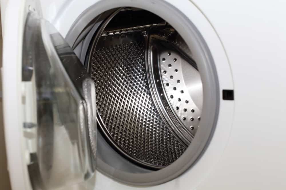 Open white front load washing machine