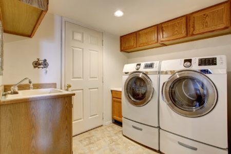 Washer and dryer in a white laundry room