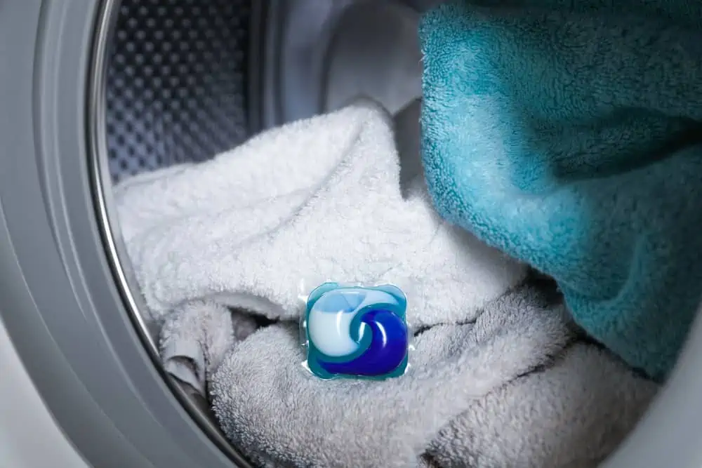 Towels with laundry detergent capsuleinside front load washing machine