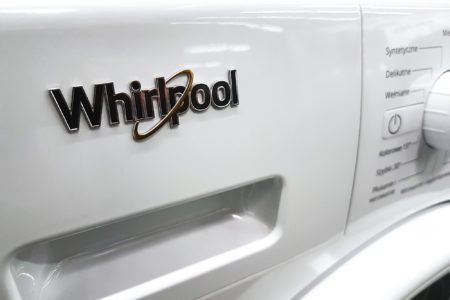Whirlpool sign on white washing machine