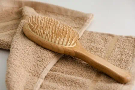 Wooden hair brush with towel