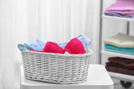White laundry basket full of underwear