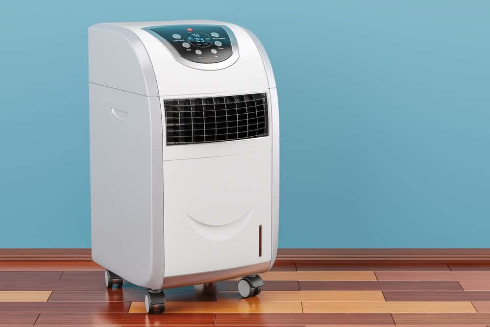 Portable air conditioner in room on the wooden floor