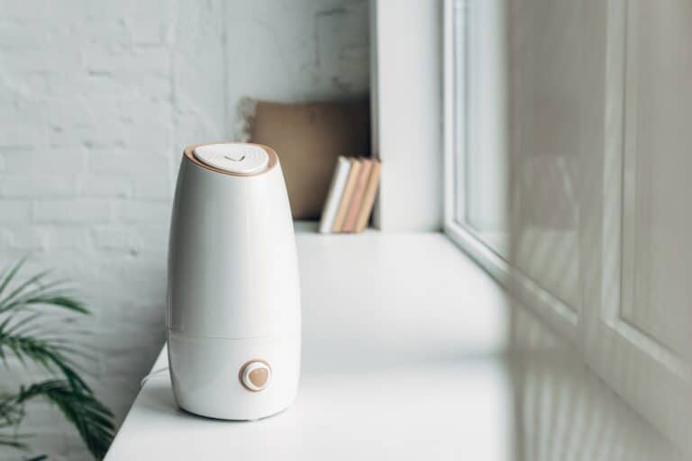 Air purifier placed near the windows with modern interior home