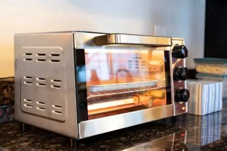 Stainless steel modern design toaster oven on the granite kitchen countertop