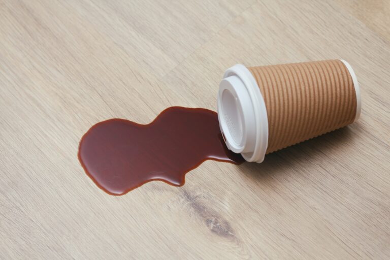 Spilled coffee on wood table